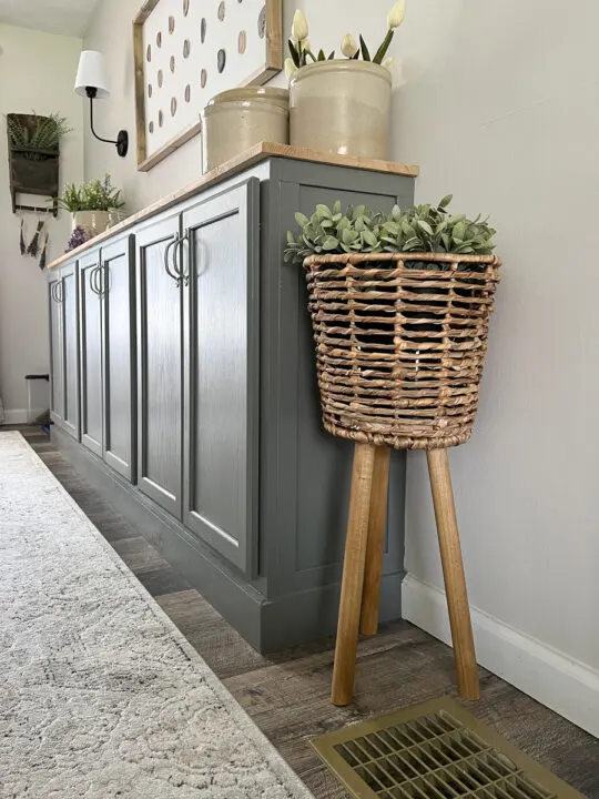 diy plant stand sitting next to stock cabinet diy buffet