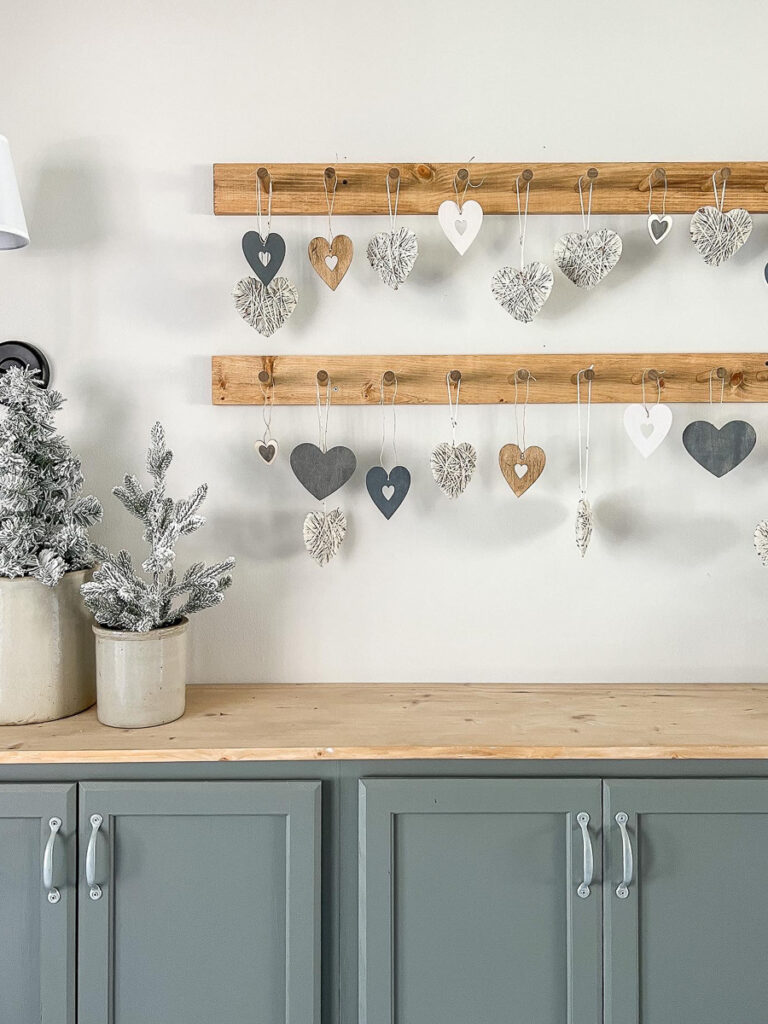 different hearts hanging from a peg rail